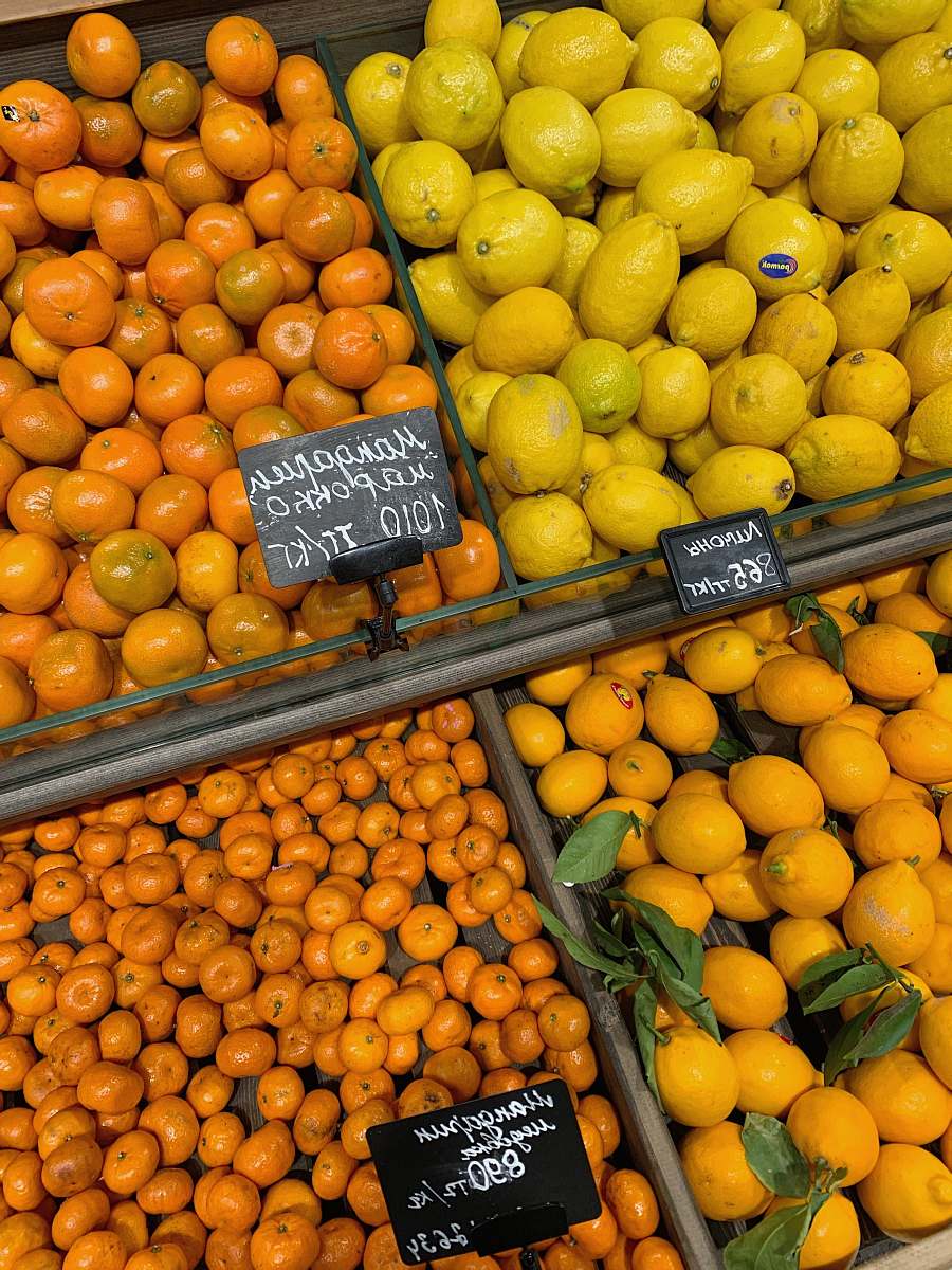 food yellow and orange fruits on brown wooden crate citrus fruit