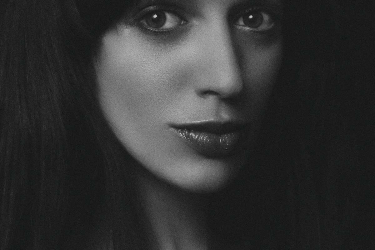 face grayscale photography of woman human