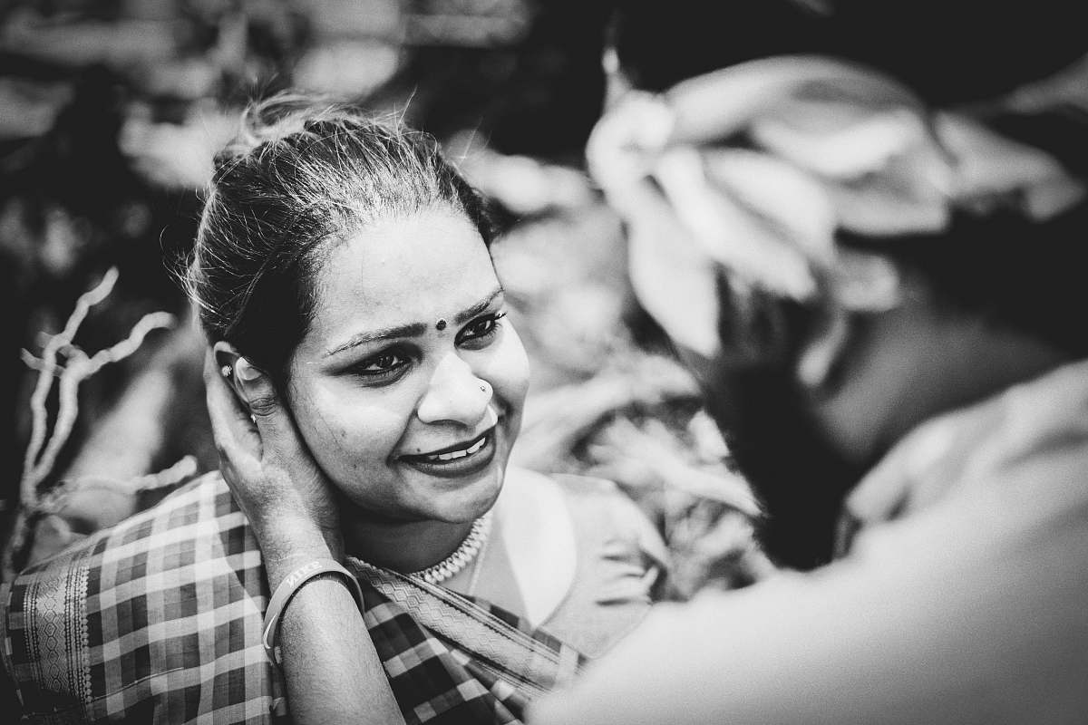person man holding woman's cheeks human
