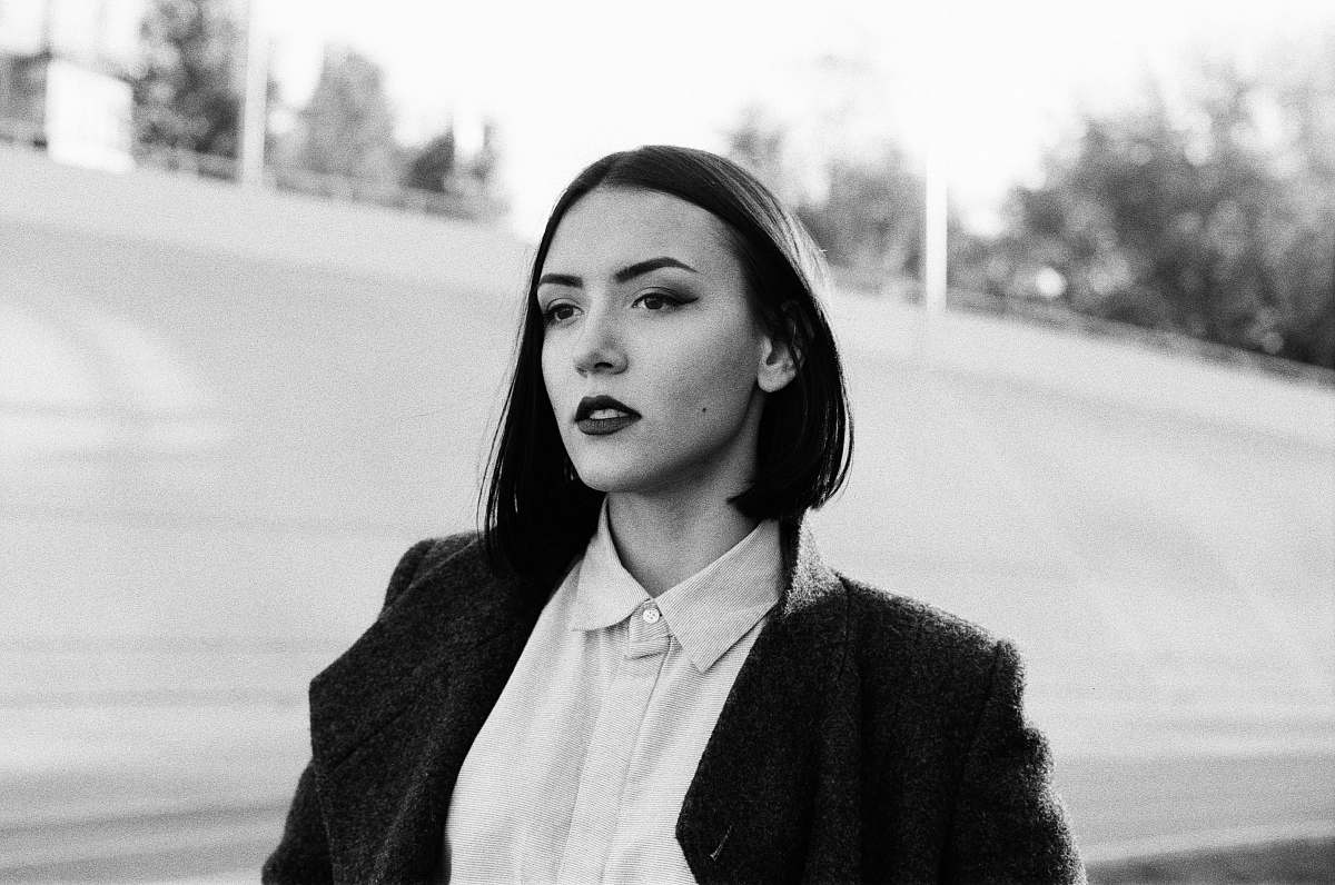 apparel woman in blazer taking pose clothing