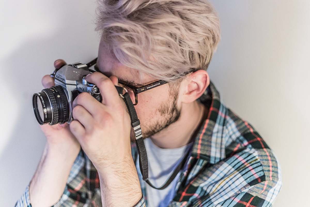 person man taking photo using camera human