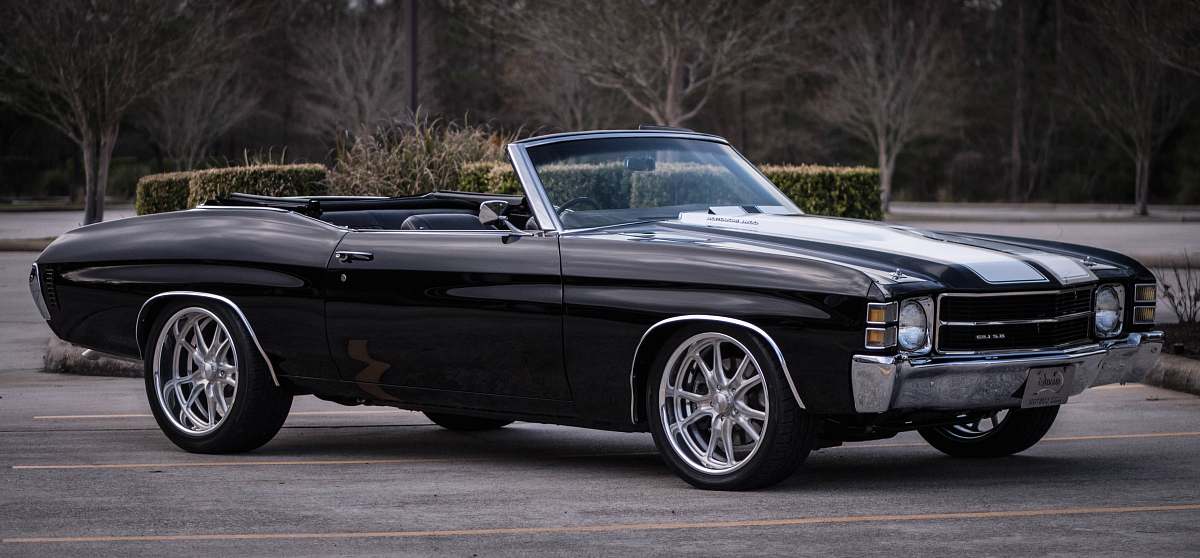 automobile black convertible coupe park on gray road convertible