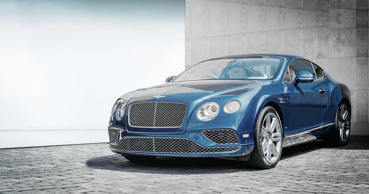 vehicle blue coupe on road transportation