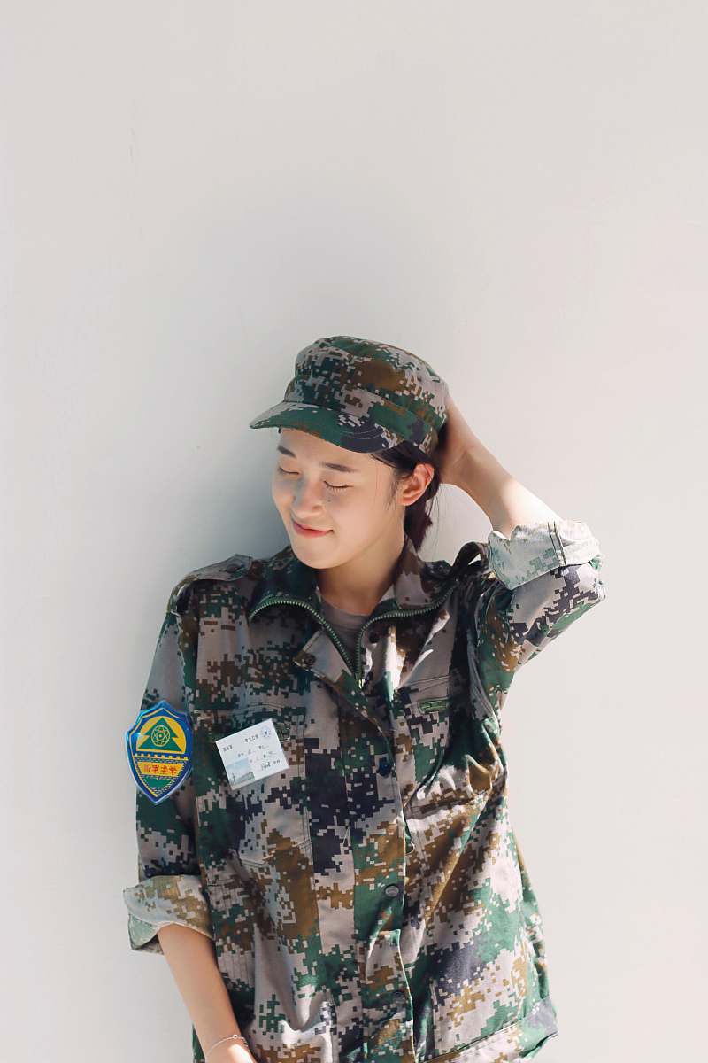 apparel woman wearing camouflage uniform hat