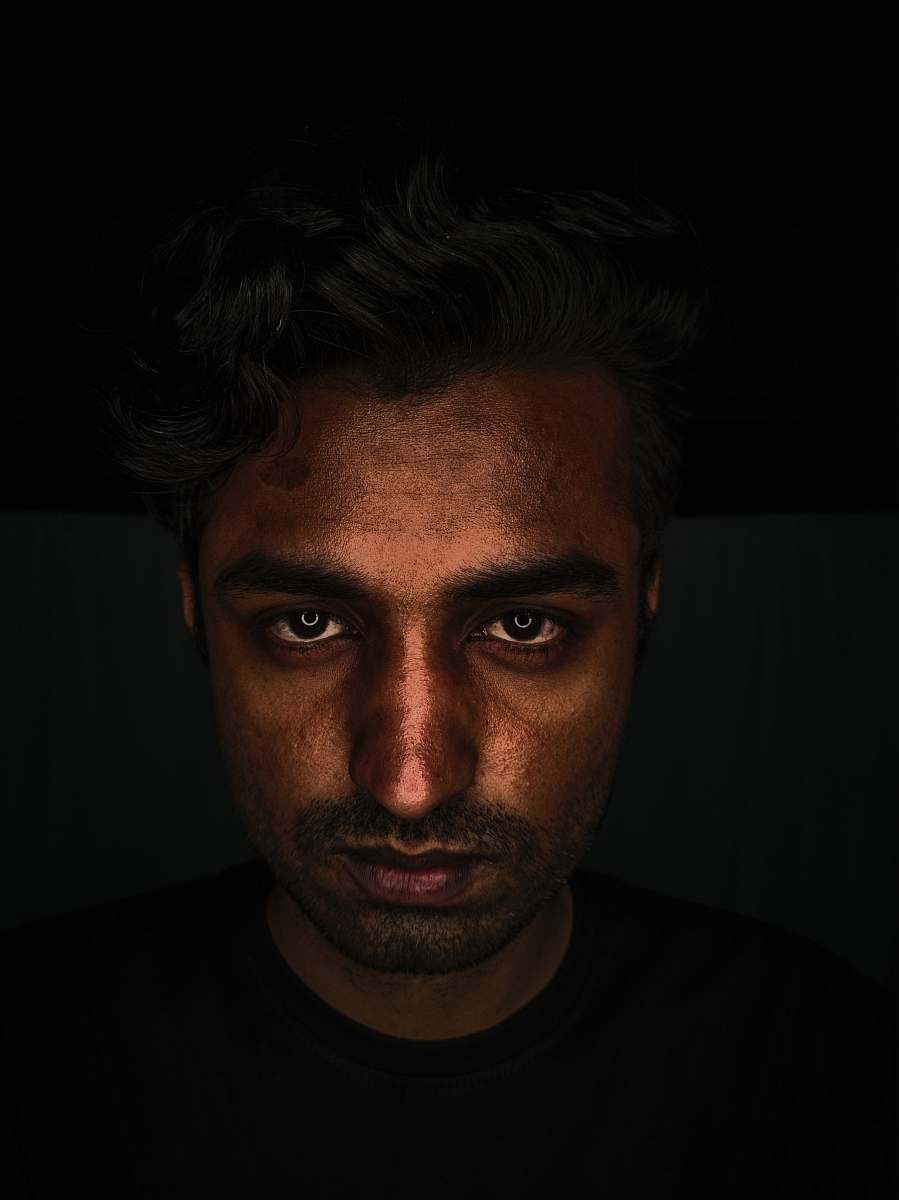 person men wearing black crew-neck shirt close-up photography human