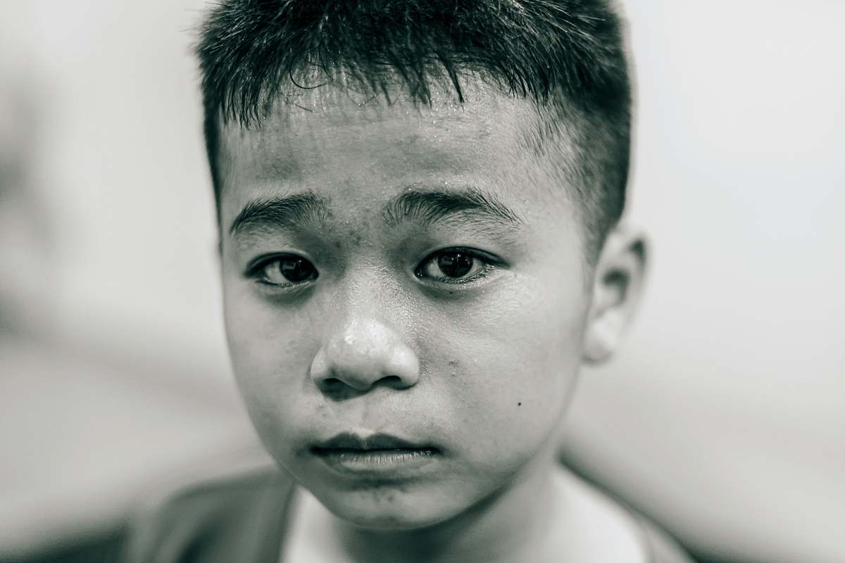 person grayscale photo of boy face