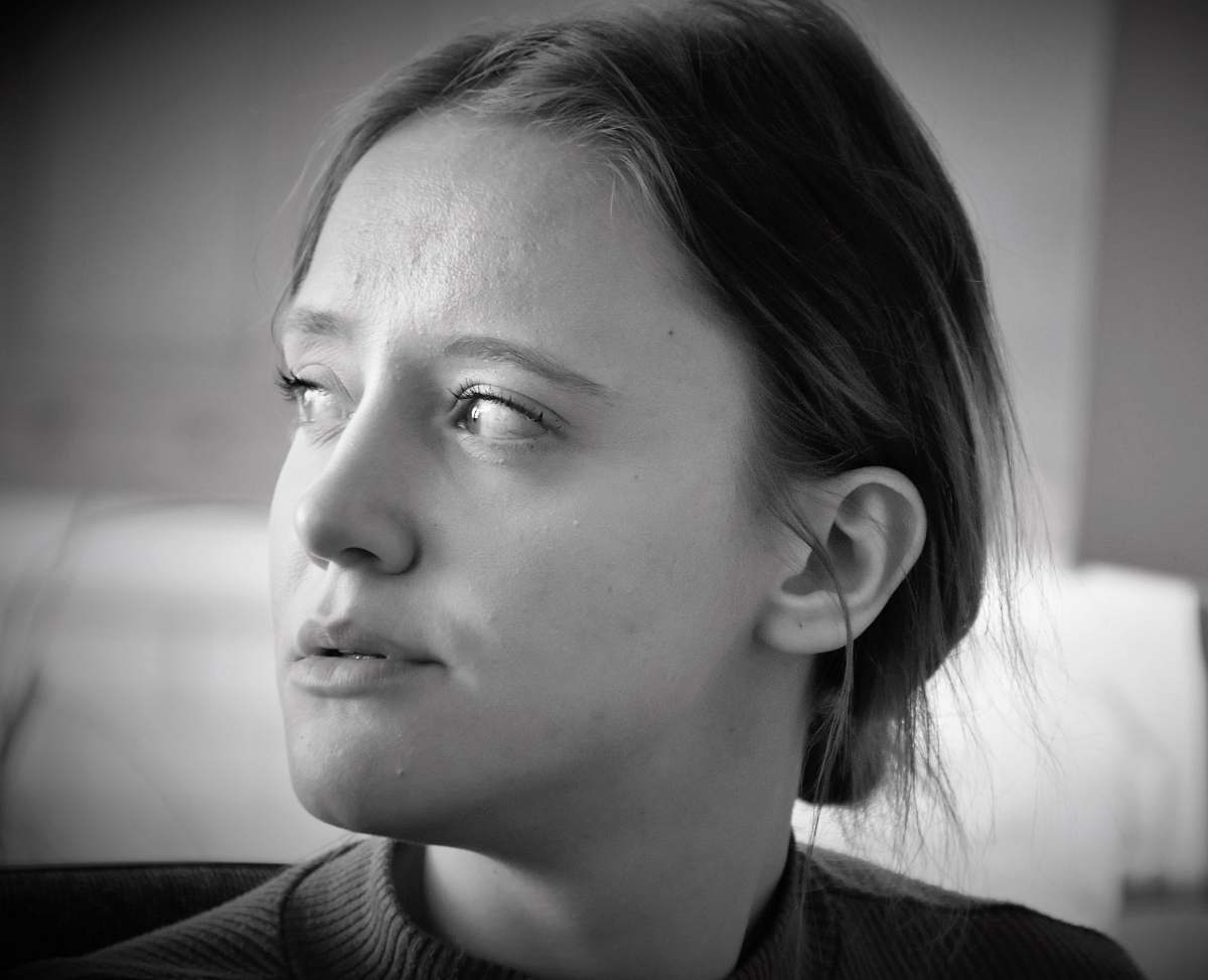 black-and-white grayscale photo of woman wearing top face