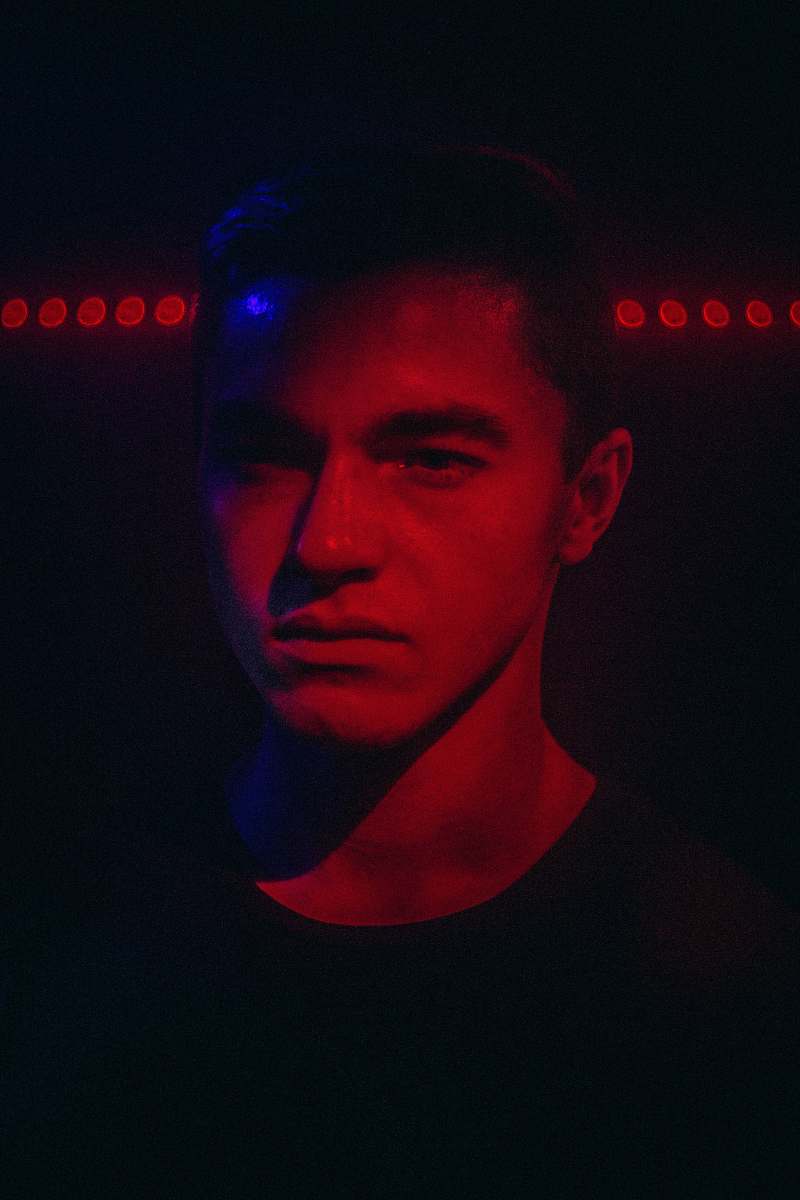person man in dim light room light