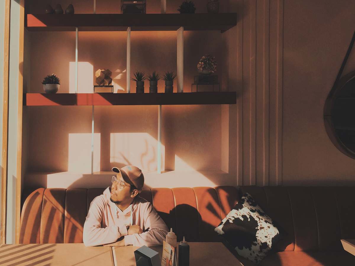 couch man sitting on sofa furniture