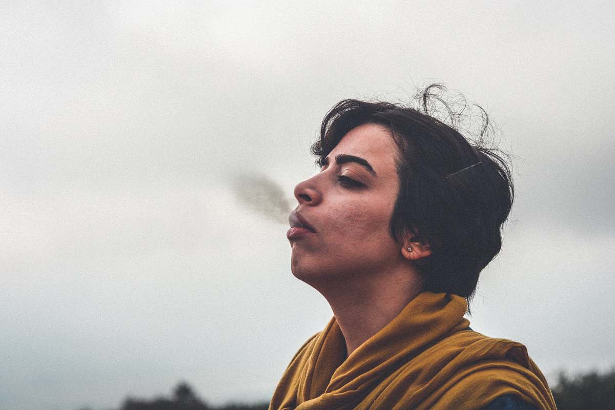 person man wearing yellow top smoking iran