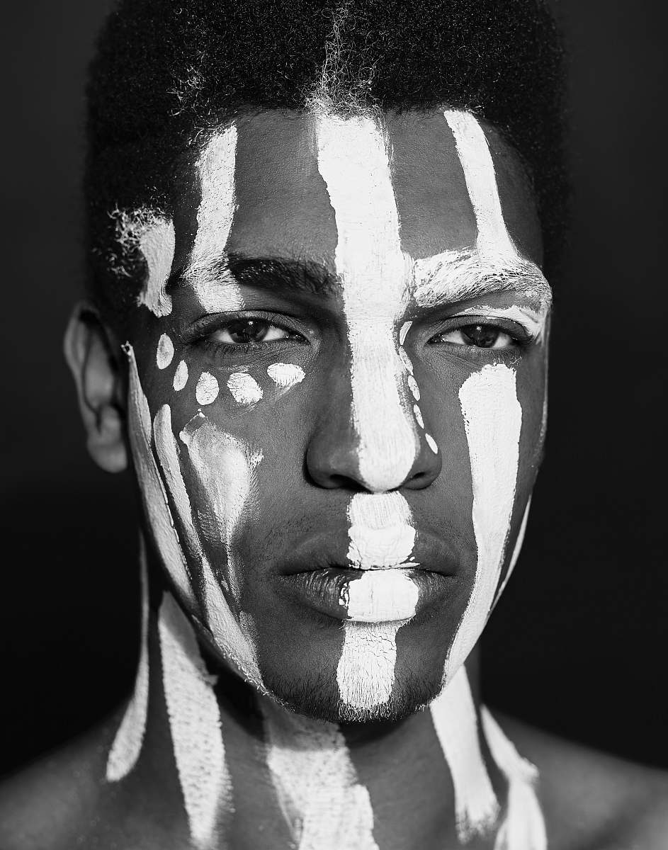 black-and-white man with white paint on face face