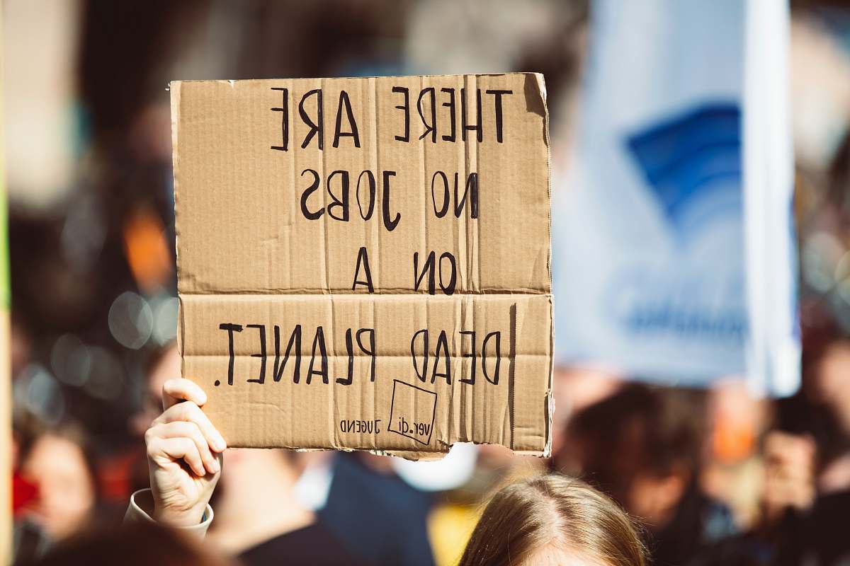 person perosn holding signage lorenzer platz