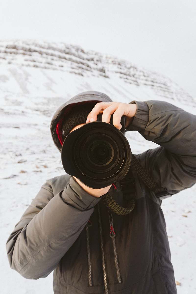 person person holding camera photographer