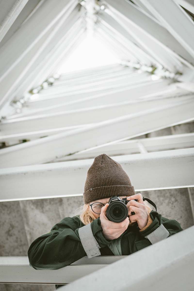 photographer person using camera during daytime camera