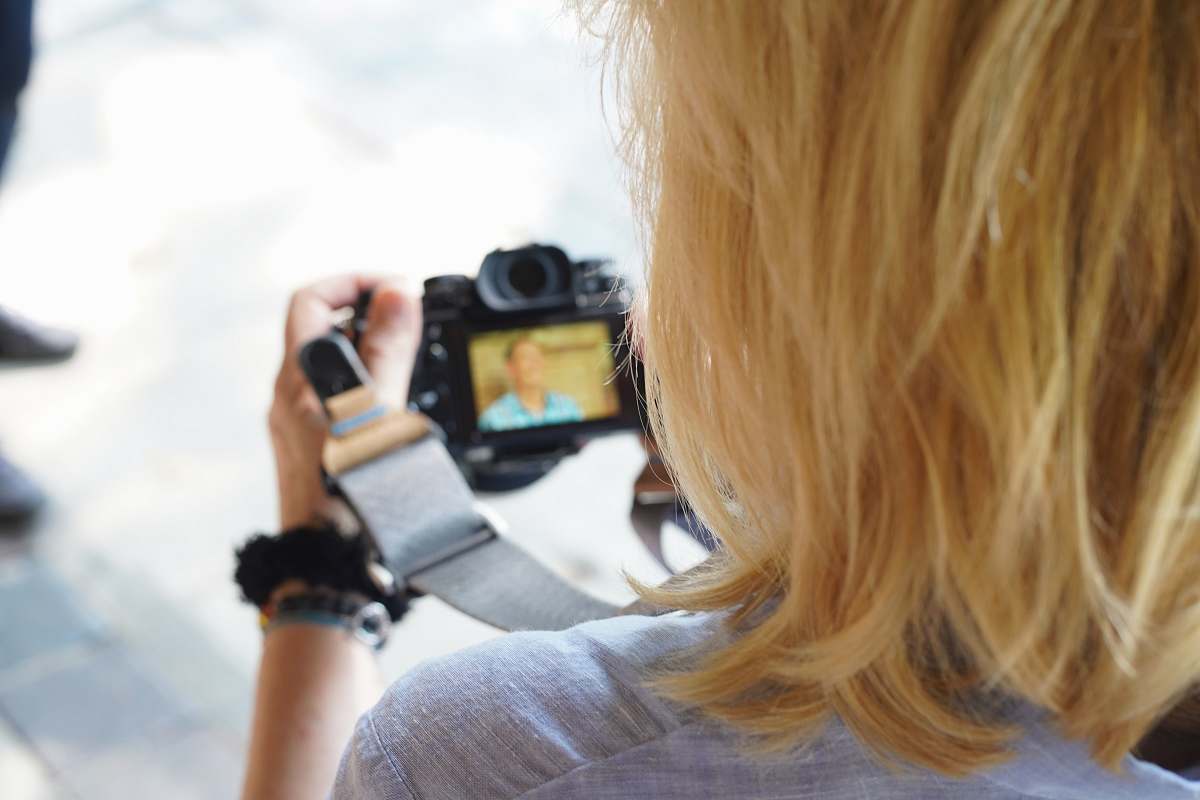person person using camera photo
