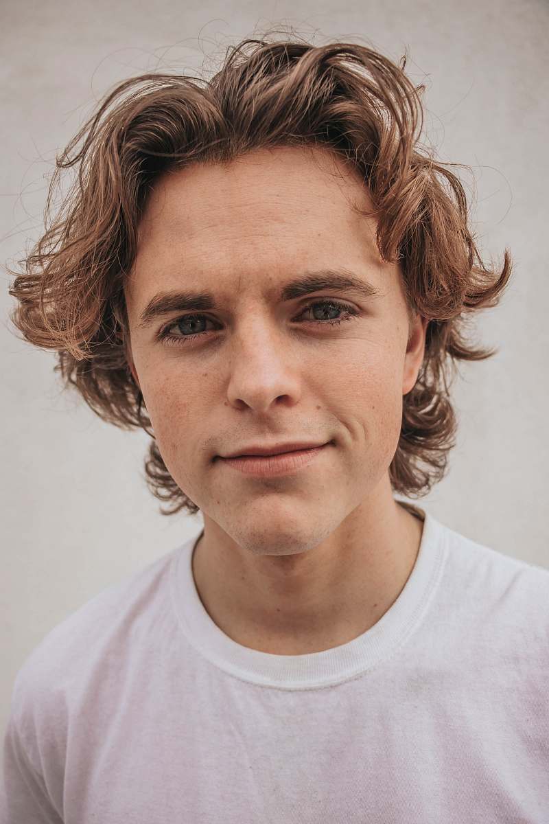 person smiling man in white crew-neck shirt face