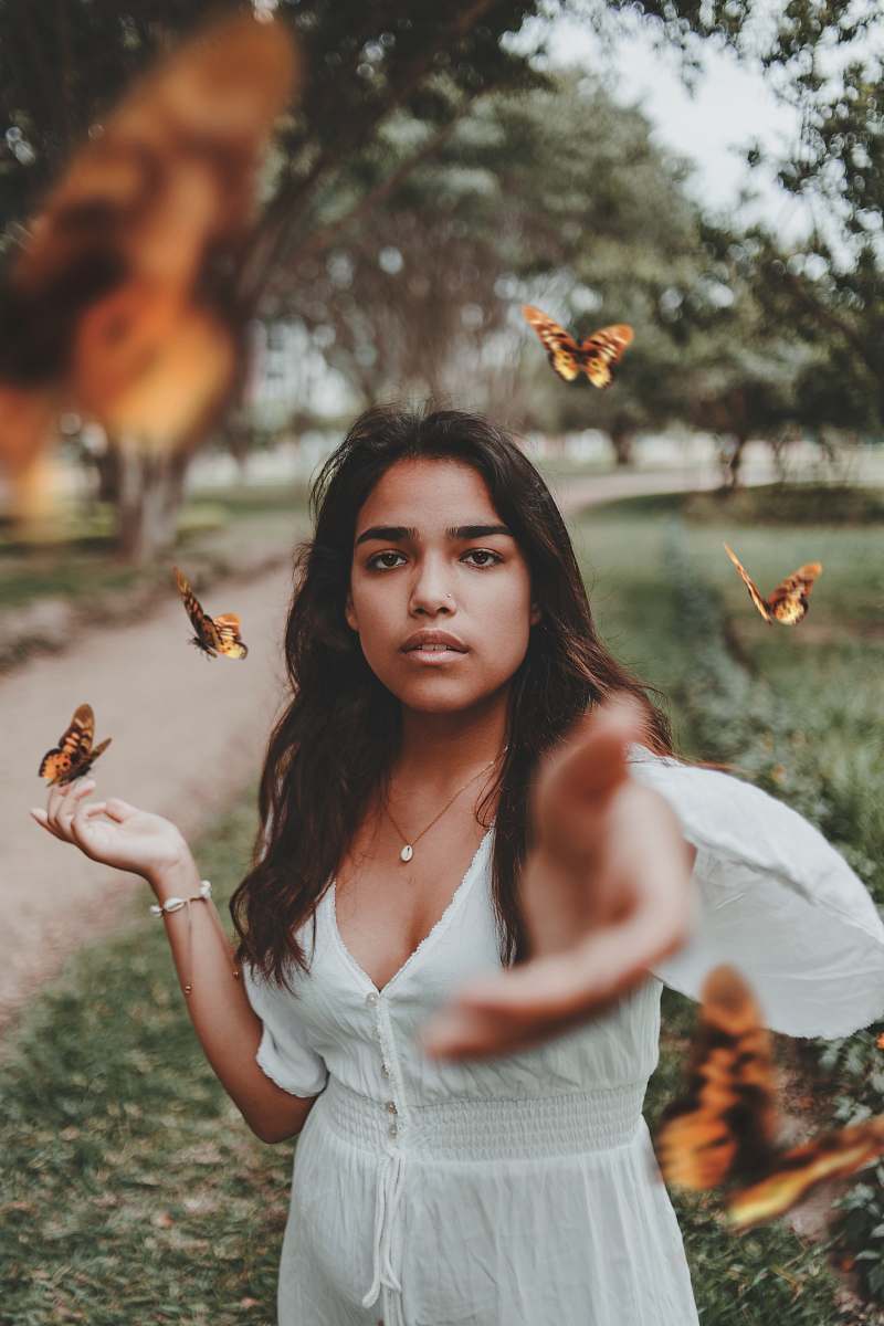 person woman in white dress butterfly