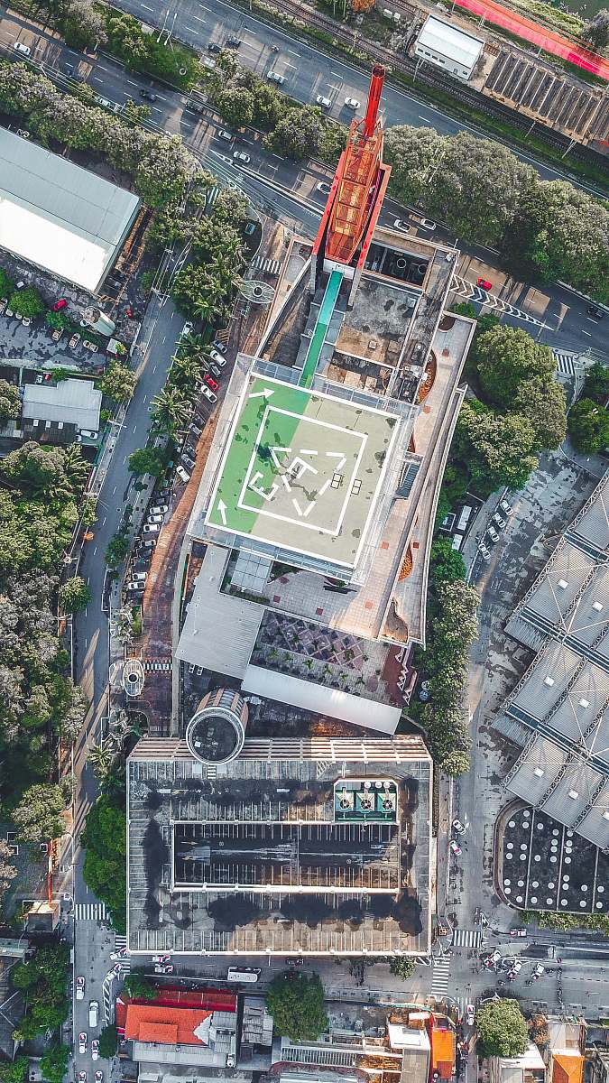 nature aerial photography of building surrounded with trees at daytime outdoors