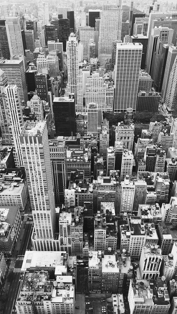 outdoors grayscale photography of city buildings black-and-white