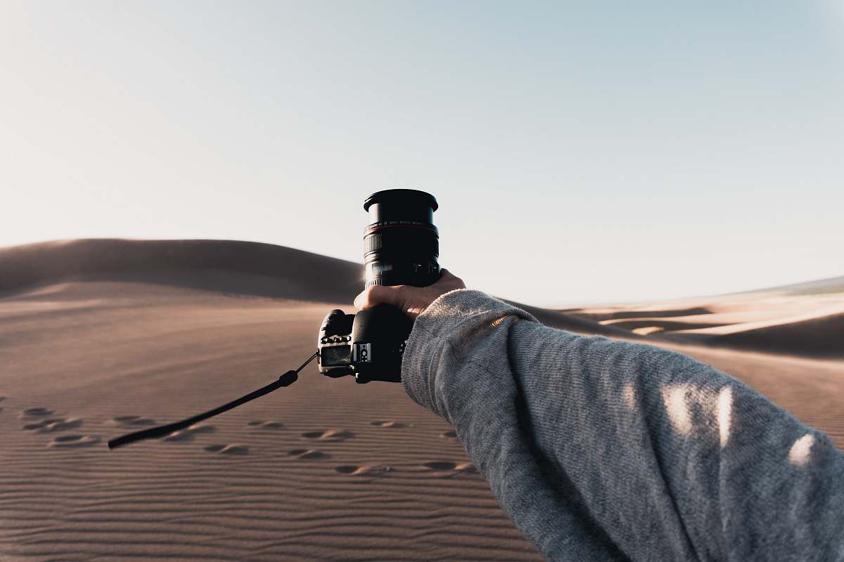 human black DSLR camera soil