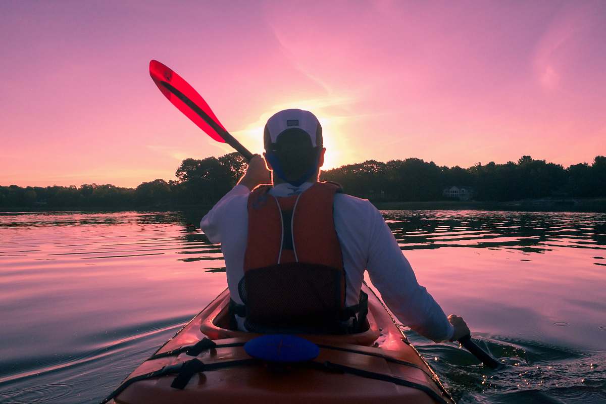 kayak man riding on kayak boat