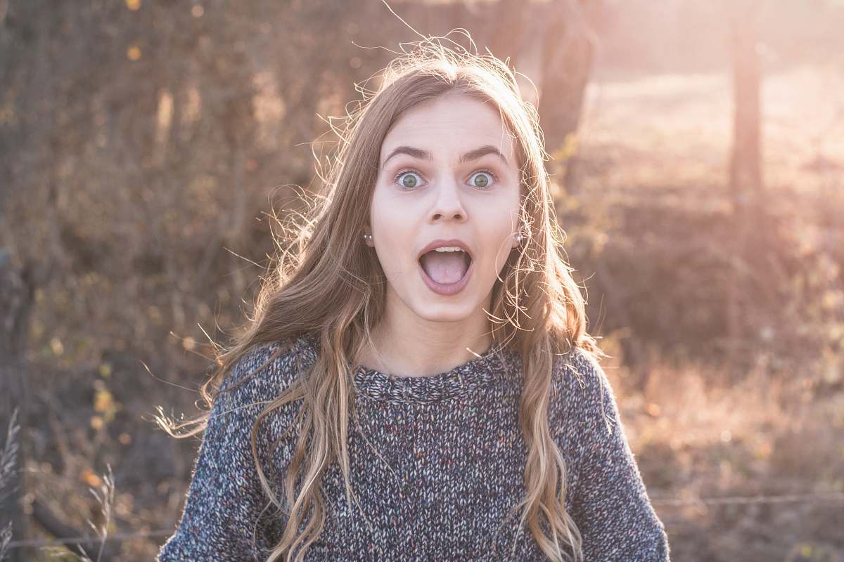 clothing woman standing showing shocking face apparel