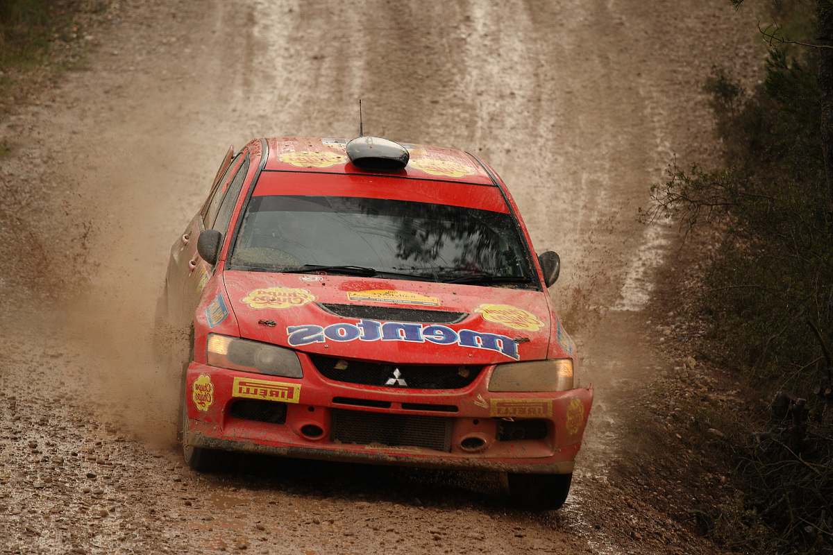 transportation red Mitsubishi Lancer on road offroad