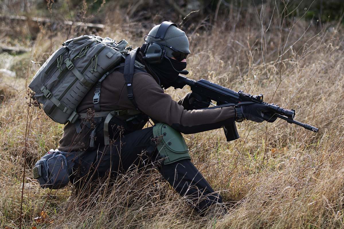 gun man holding rifle apparel