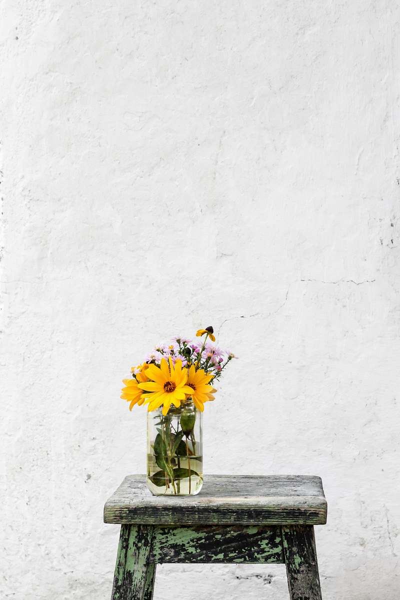 flower sunflower with clear glass vase on gray table wall