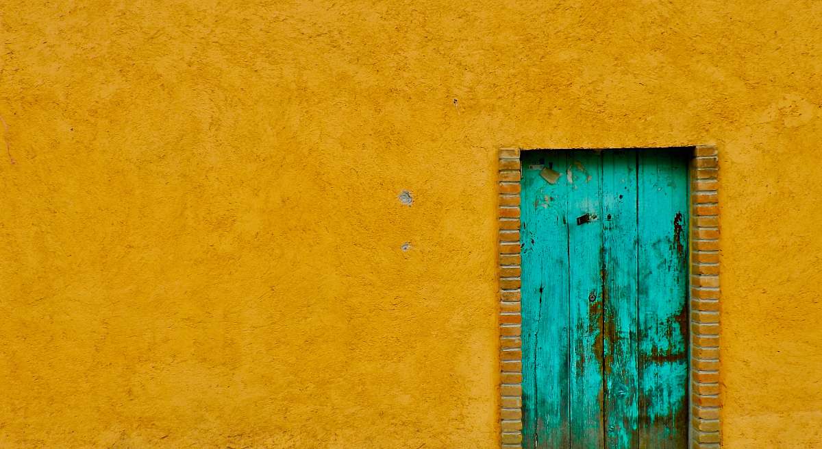 blue closed green wooden door wall