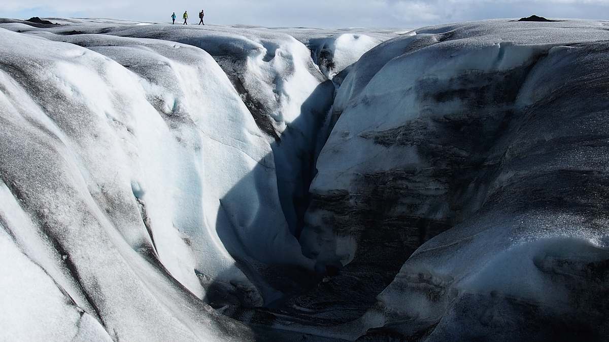 snow people on top of gray mountain during daytime nature