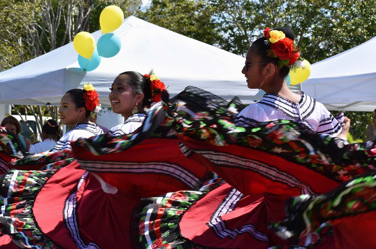 festival woman wearing red and white dress crowd