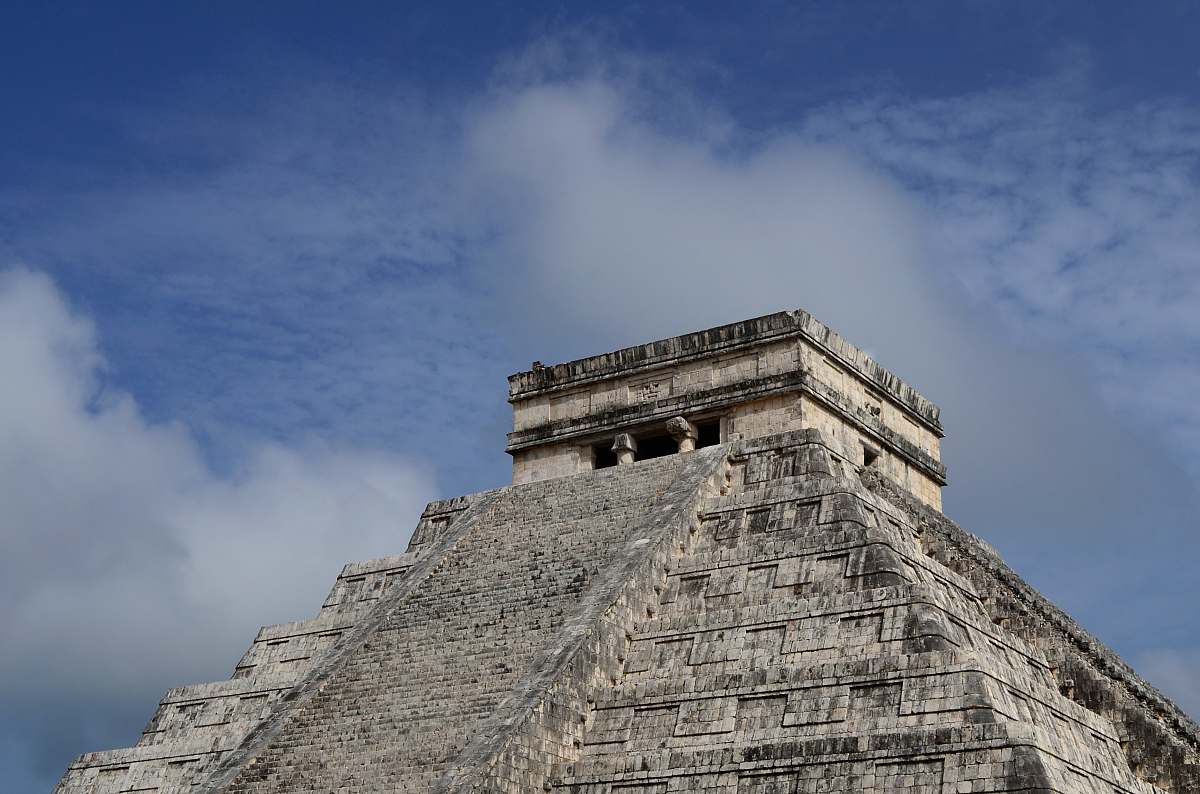 building brown pyramid during day time architecture