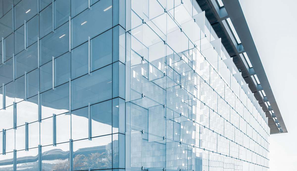 architecture architectural structure photography of glass building under cloudy sky blue