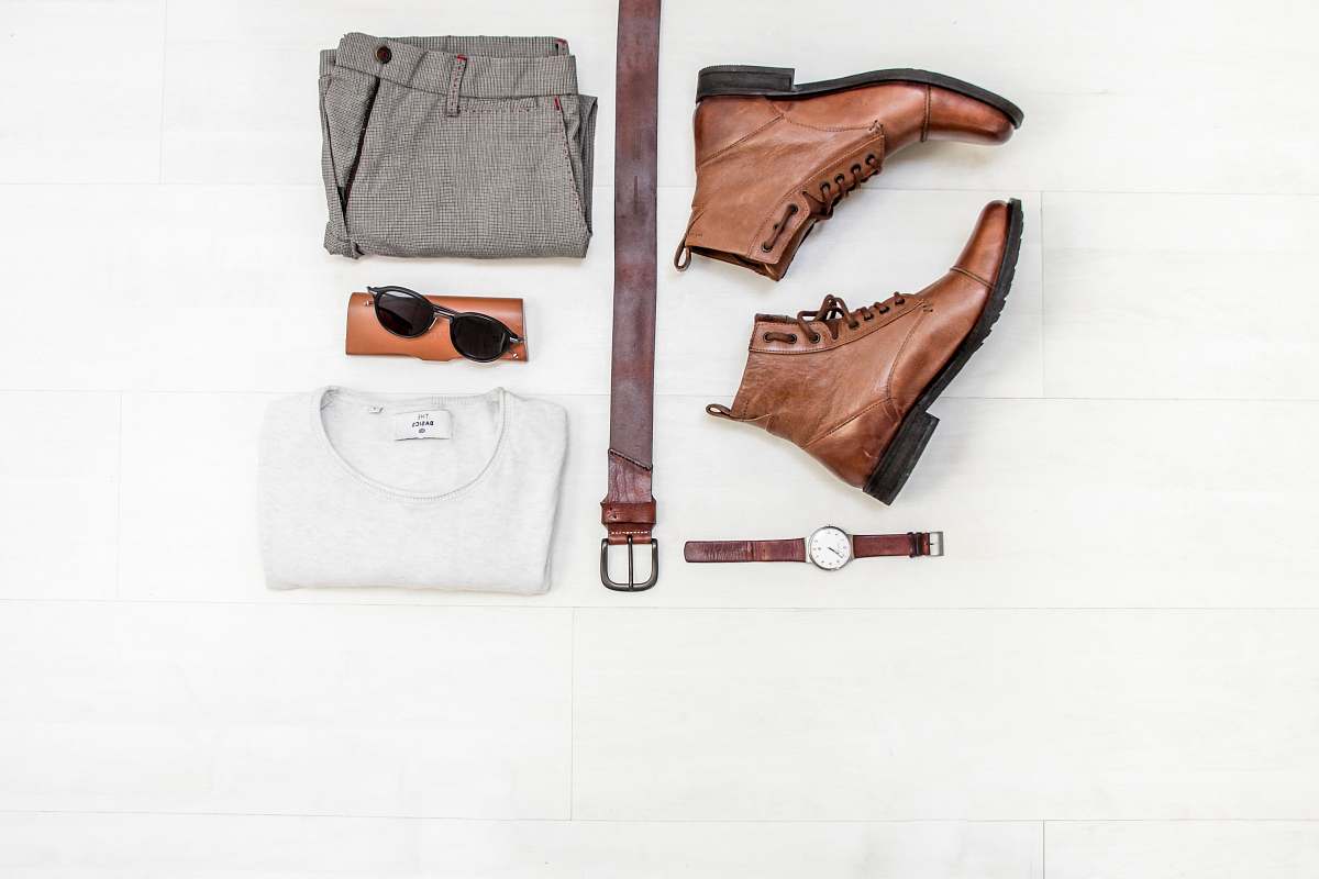 pair of brown leather boots beside bet 