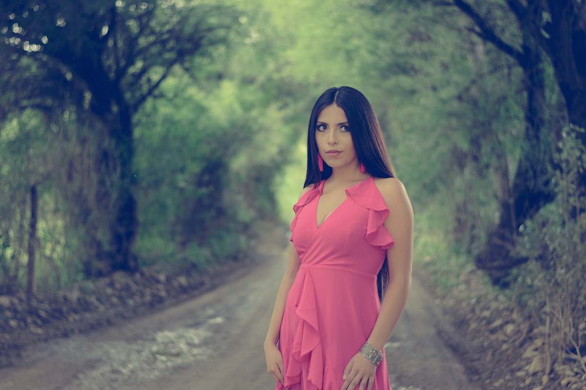clothing woman in pink deep V-neck sleevlessleeveless dress evening dress