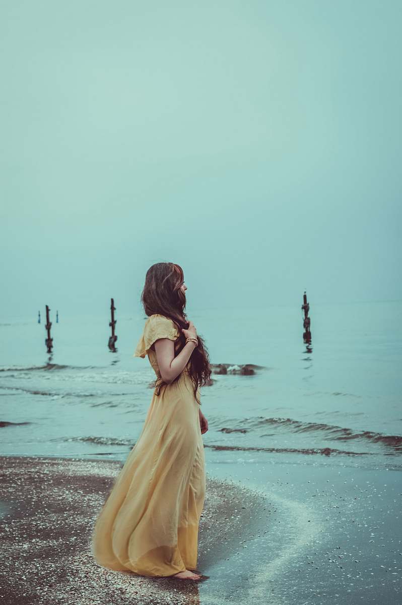 clothing woman standing on shore evening dress