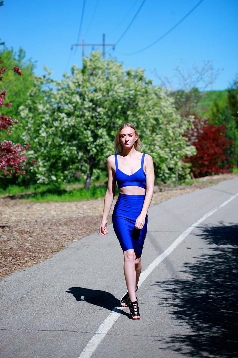 clothing woman walking on road near trees fashion
