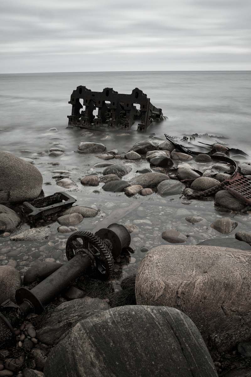 grey sea under cloudy sky rubble