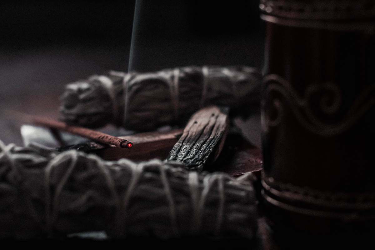 smoke shallow focus photography of lighted incense basket