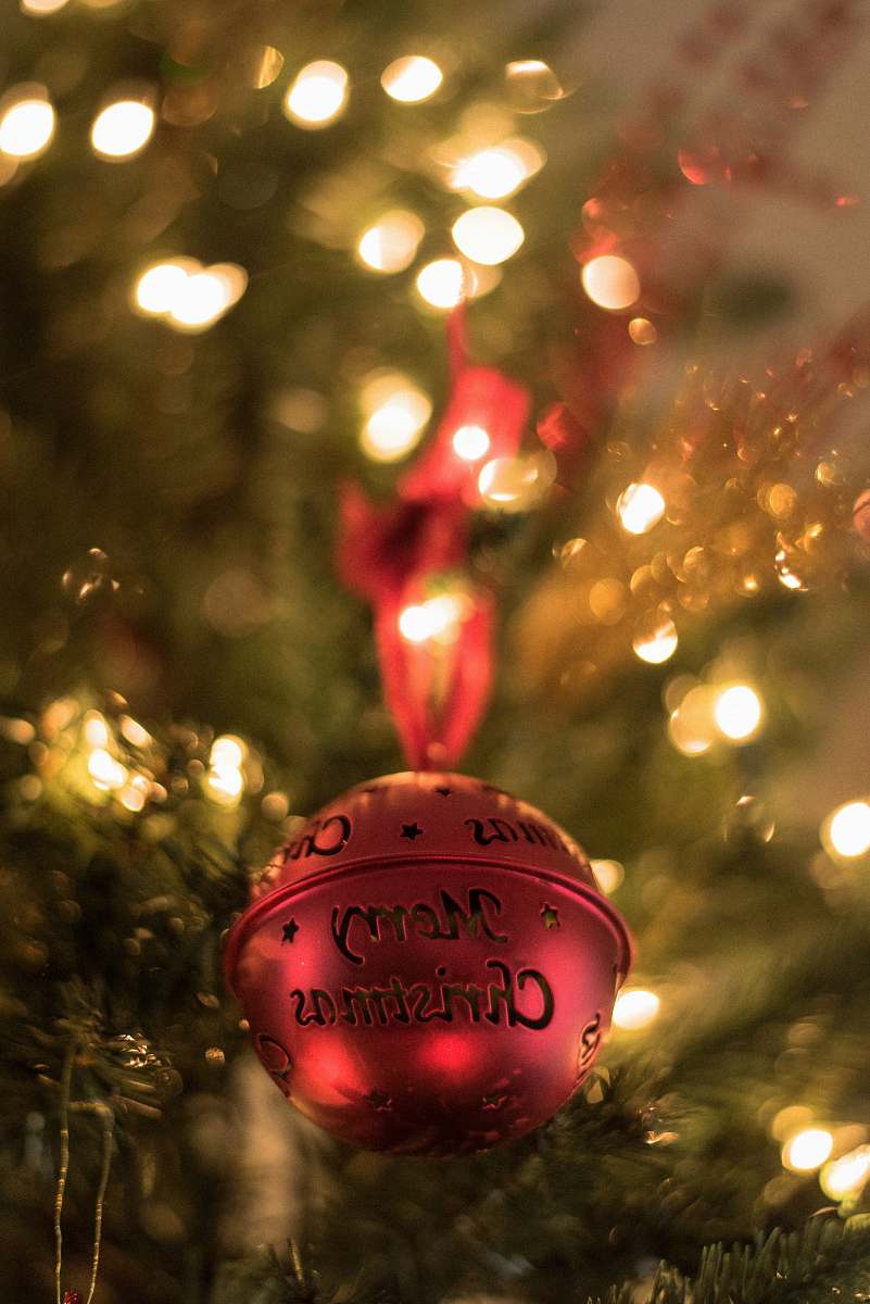 holiday red Christmas bell on Christmas tree ornament