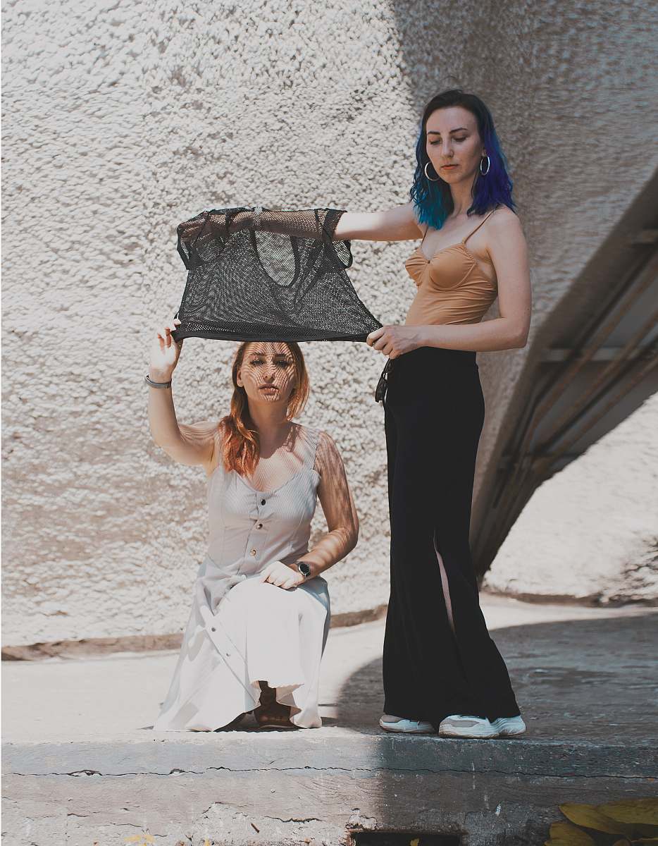 apparel two women near wall evening dress