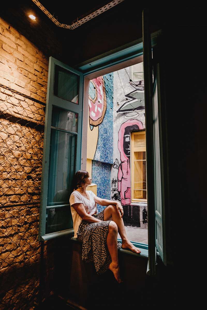 fashion woman sitting by the doorway apparel