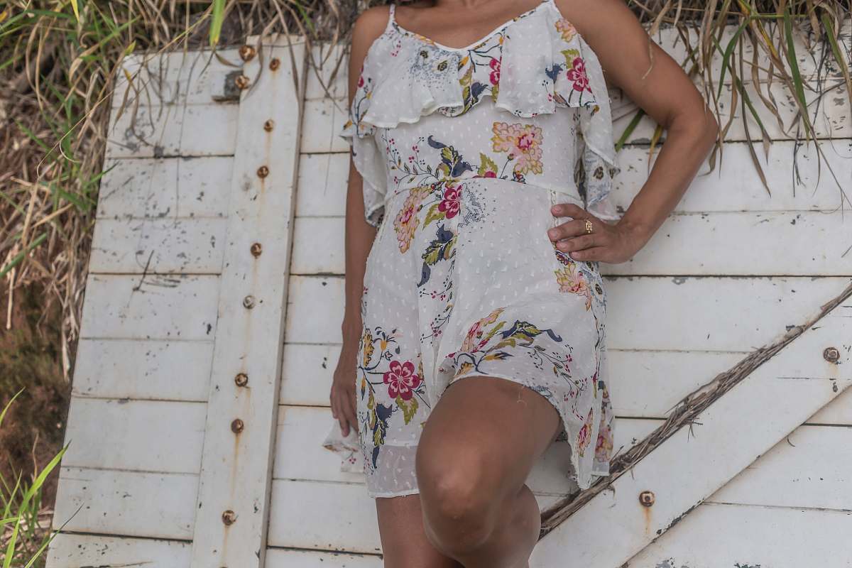 apparel woman wearing multicolored floral cami dress fashion