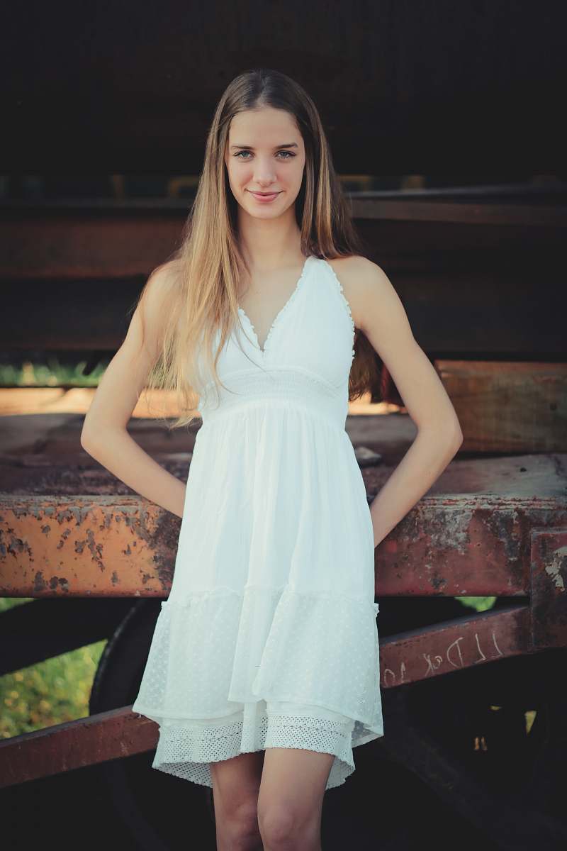 apparel woman wearing white V-neck sleeveless dress evening dress