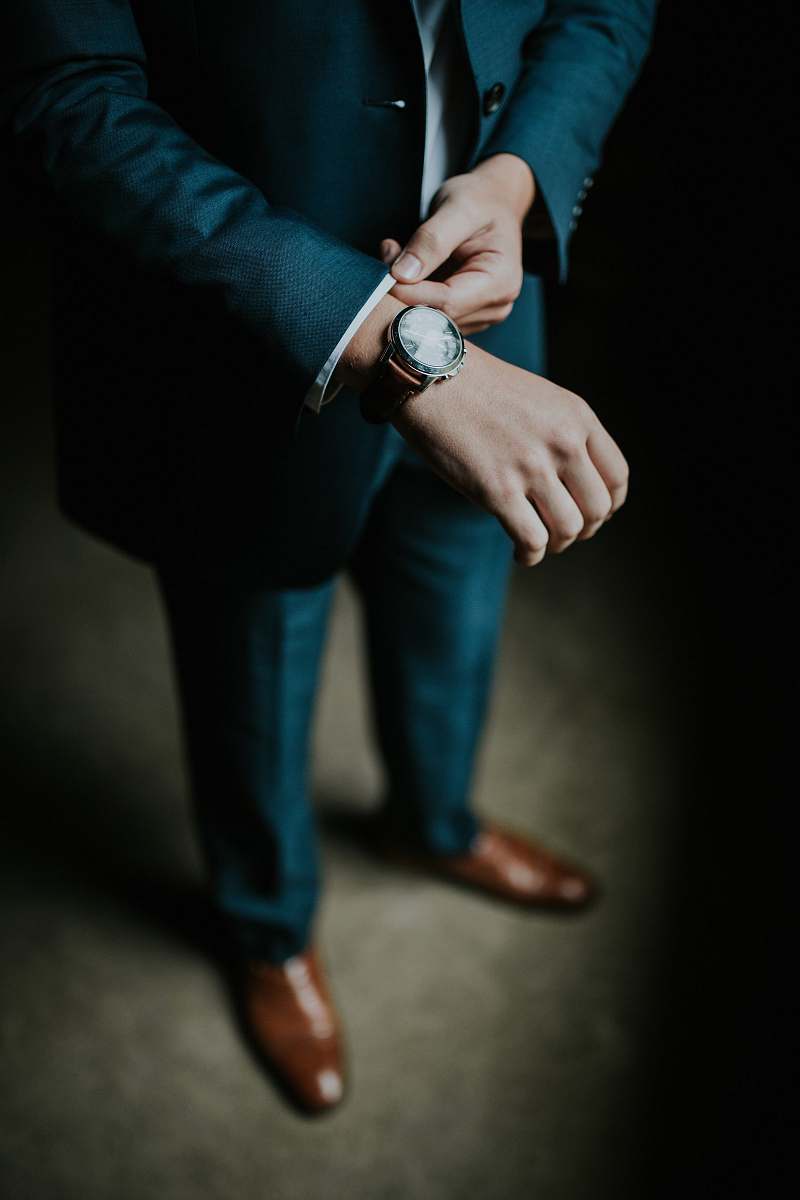 person man holding his black suit people
