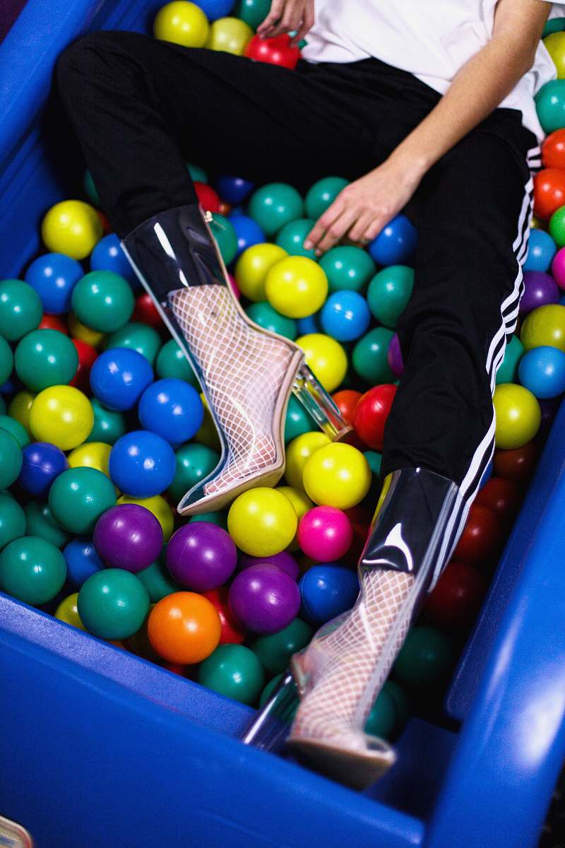 shoes person sitting on assorted-color plastic ball lot seattle