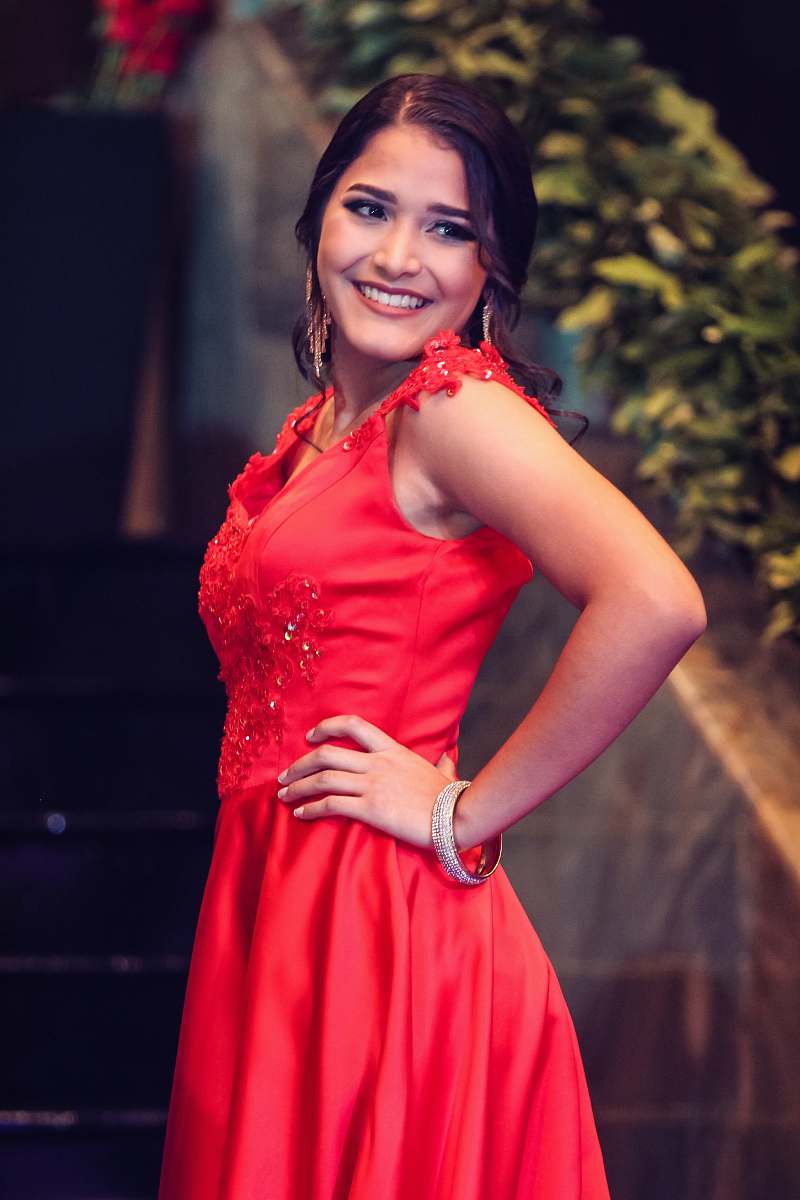apparel smiling woman wearing red floral sleeveless dress evening dress