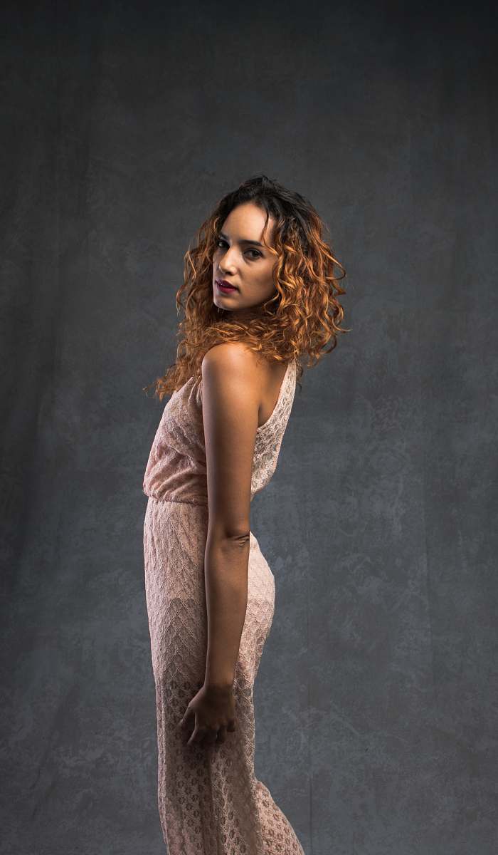 apparel woman wearing beige sleeveless dress clothing