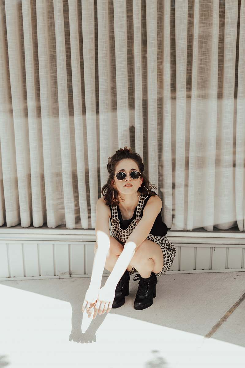 clothing woman wearing gray and black dress sunglasses